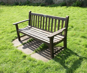 Benchmark bench on the lawn